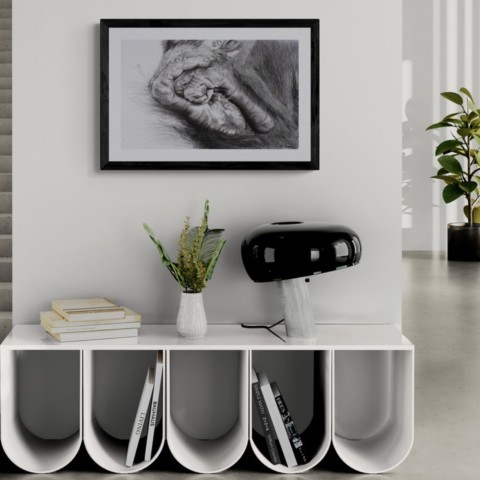 AVAILABILITY Charcoal artwork of orangutan feet displayed above a living room cabinet – wildlife artist Laurence Saunois