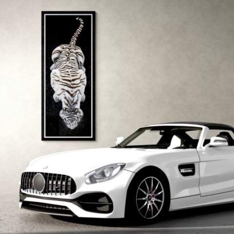 Painting of a white tiger seen from above, displayed in a setting above a luxury car