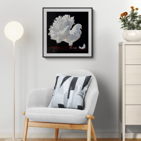 Painting of a white pigeon displayed above an armchair by wildlife artist Laurence Saunois.