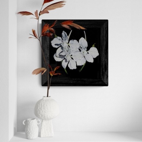 Painting of white flowers displayed above a console table by wildlife artist Laurence Saunois.