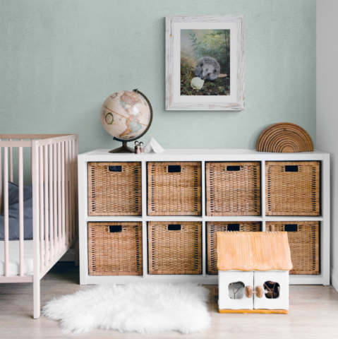 Hedgehog with an apple painting wall art decor in a child's bedroom setting by wildlife artist Laurence Saunois
