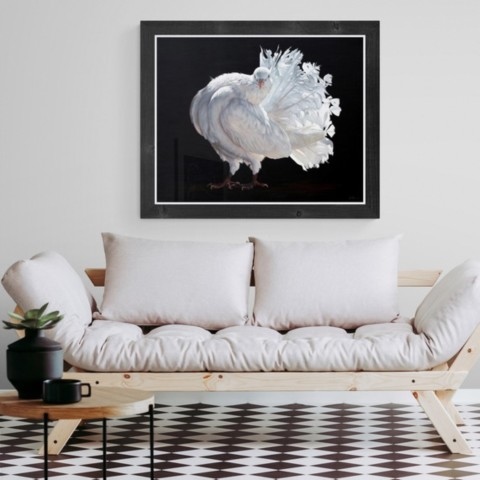 Painting of a white fantail pigeon displayed in a living‑room setting above a sofa by wildlife artist Laurence Saunois