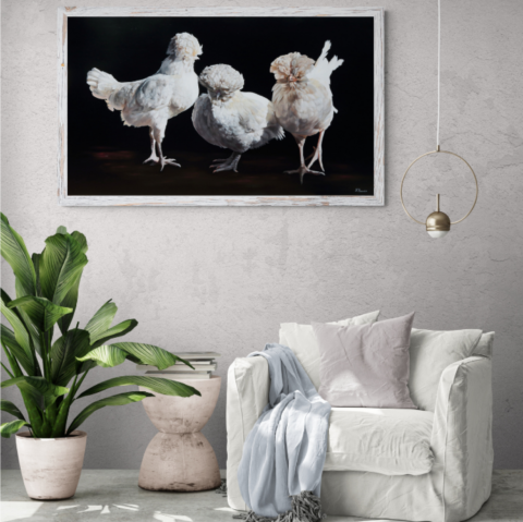 “Painting of three white hens displayed in a living‑room setting by wildlife artist Laurence Saunois.