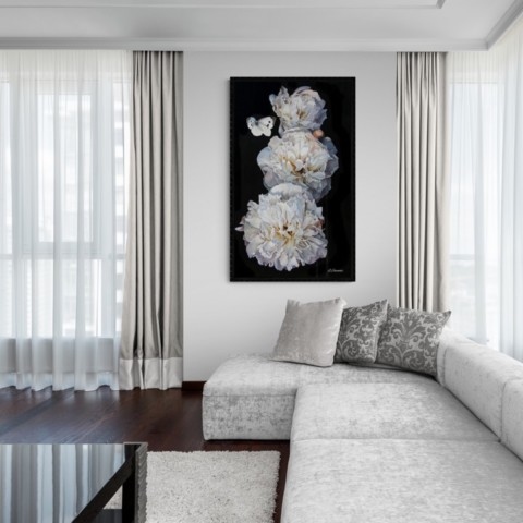 “Painting of white peonies displayed in a living‑room setting above a sofa by wildlife artist Laurence Saunois.